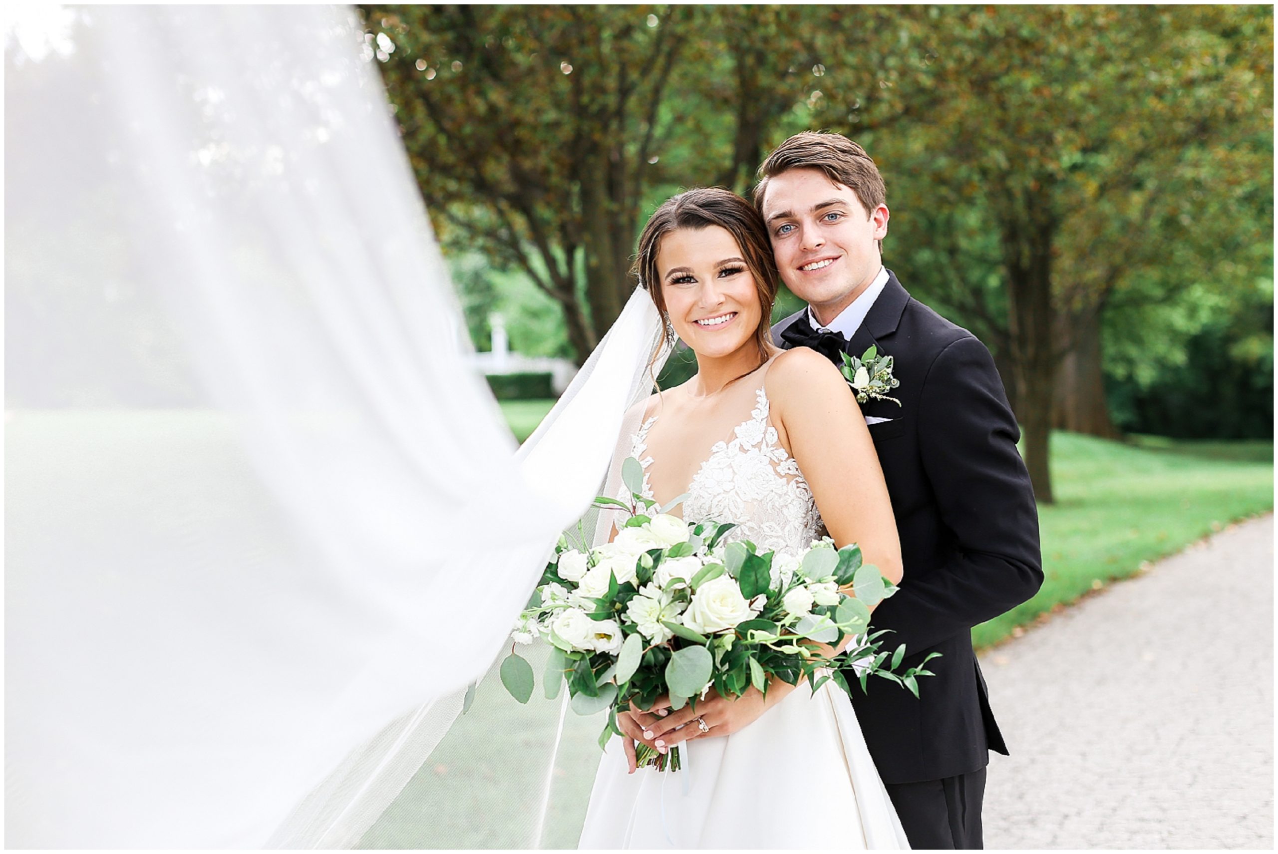 bride and groom with veil at the hawthorne house