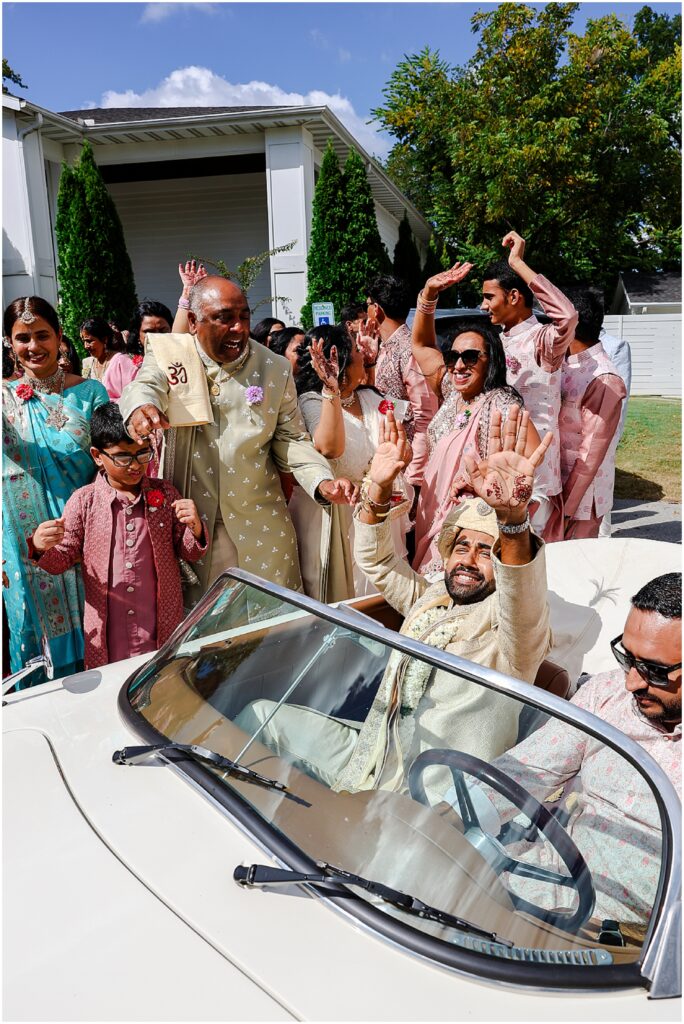 A stunning South Asian wedding at the Ballroom on I Street, filled with classic white florals and colorful baraat celebrations!