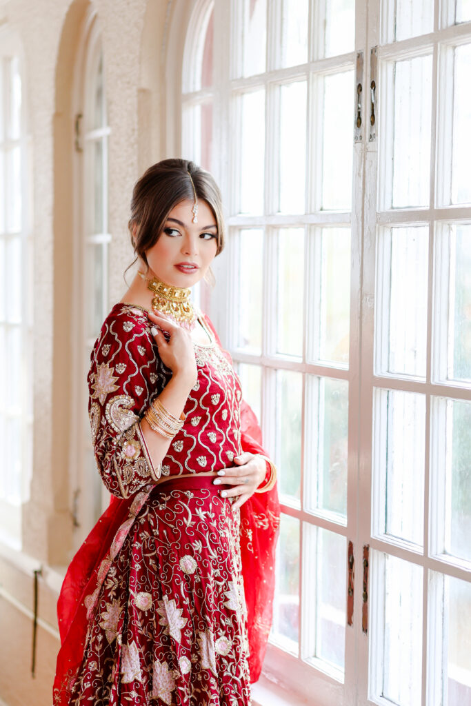 Photographers capturing stunning bridal portraits at Longview Mansion during the Kansas City workshop. South Asian Bollywood Indian Wedding Photography - Mariam Saifan